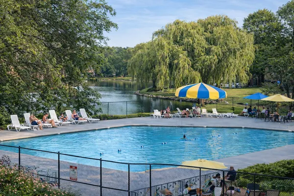 a view of a wooden deck and a backyard