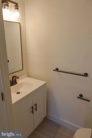 a bathroom with a sink and mirror