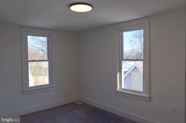 an empty room with windows