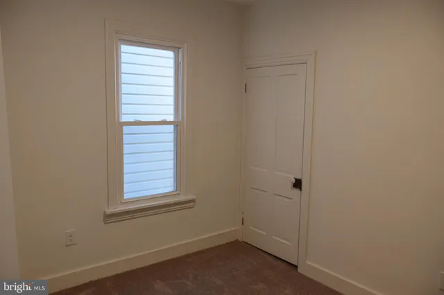 a view of a room that has a window in it
