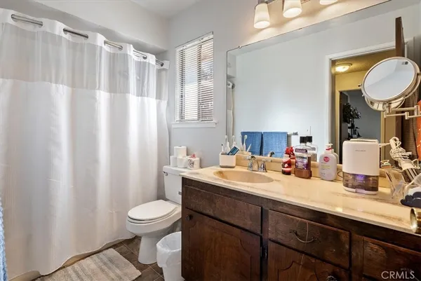a kitchen with a white stove top oven and white cabinets