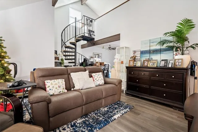 a bedroom with furniture and a window