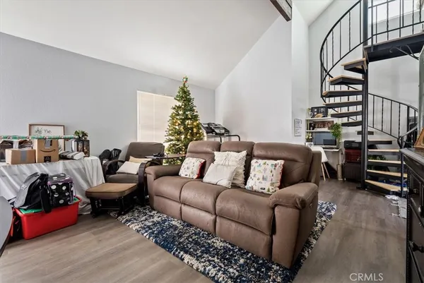 a bathroom with a toilet a sink a mirror a shower curtain