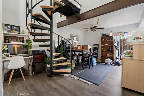 a view of a dining room with furniture and a large window