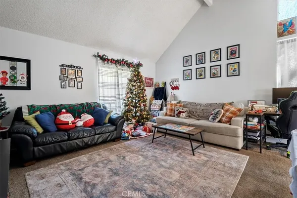 a view of a dining room with furniture and a window