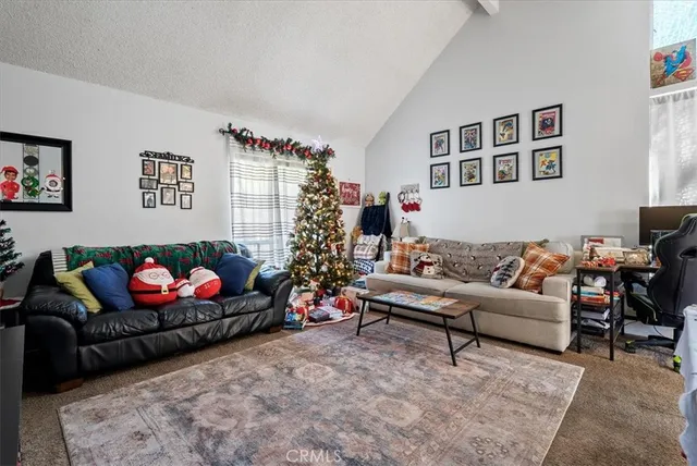 a view of a dining room with furniture and a window