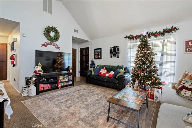 a bedroom with a bed and a tv