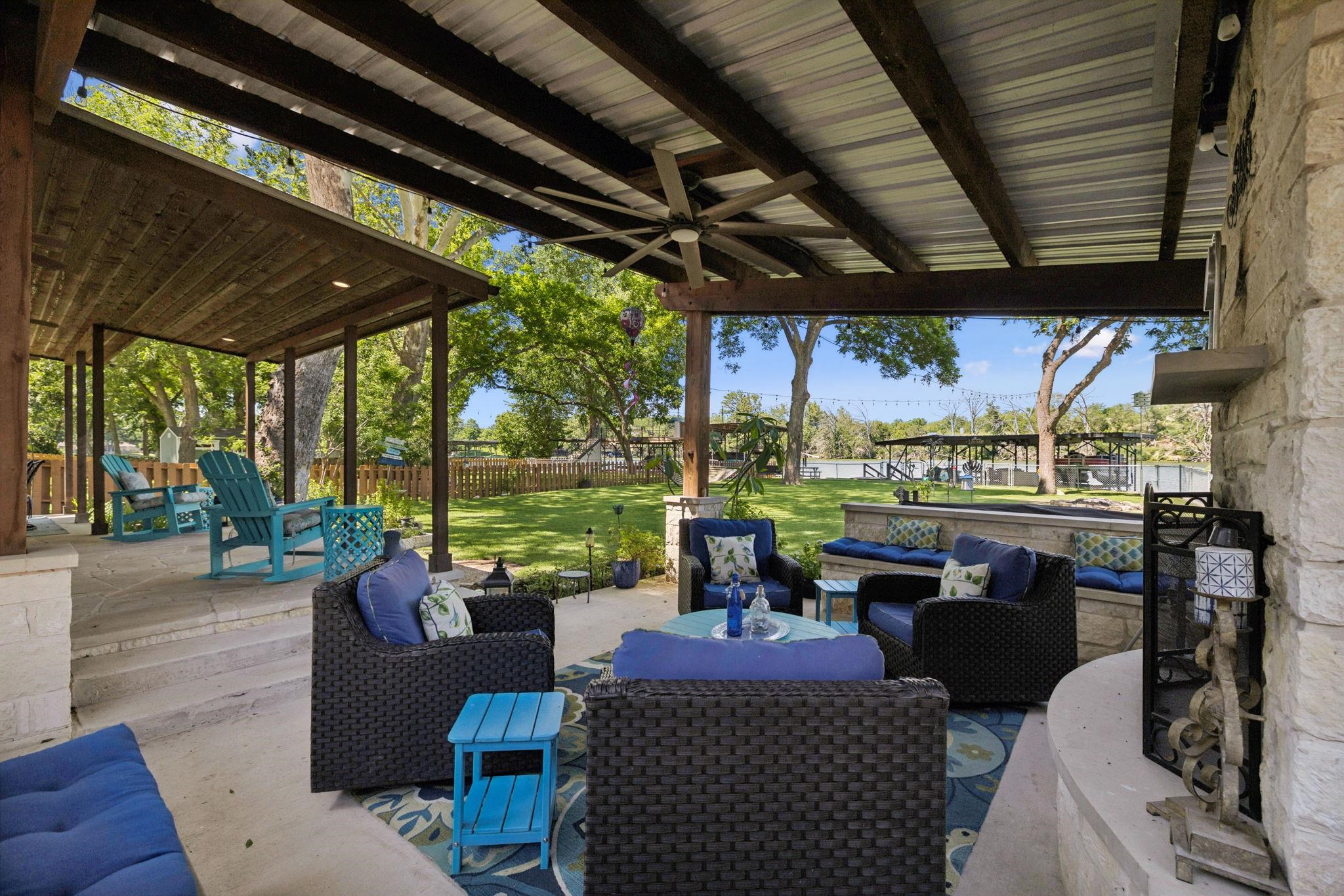 1435 East Zipp Road New Braunfels, TX 78130 - Photo 10 of 43 a outdoor living space with patio furniture and a garden