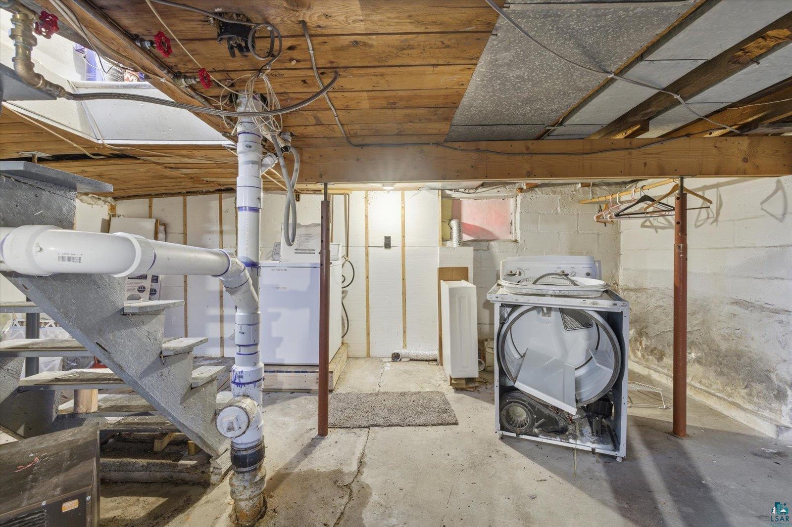 50 Main Street Soudan, MN 55782 - Photo 24 of 31 Unfinished basement space featuring exposed wood joists and concrete flooring