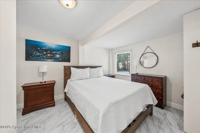 a kitchen with a stove a sink a microwave a dining table and chairs