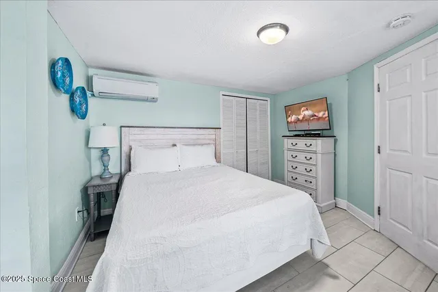 a bedroom with two beds and a table