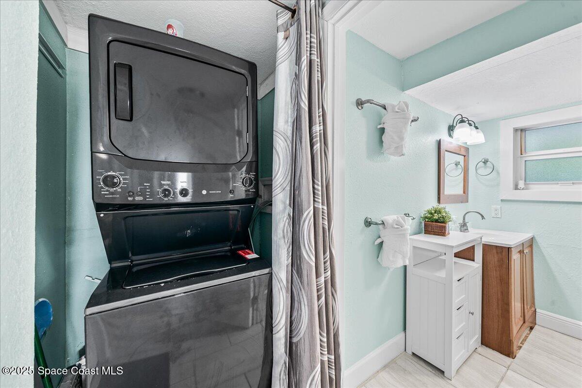 111 South Atlantic Avenue Cocoa Beach, FL 32931 - Photo 29 of 71 a living room with a fireplace furniture and a fireplace