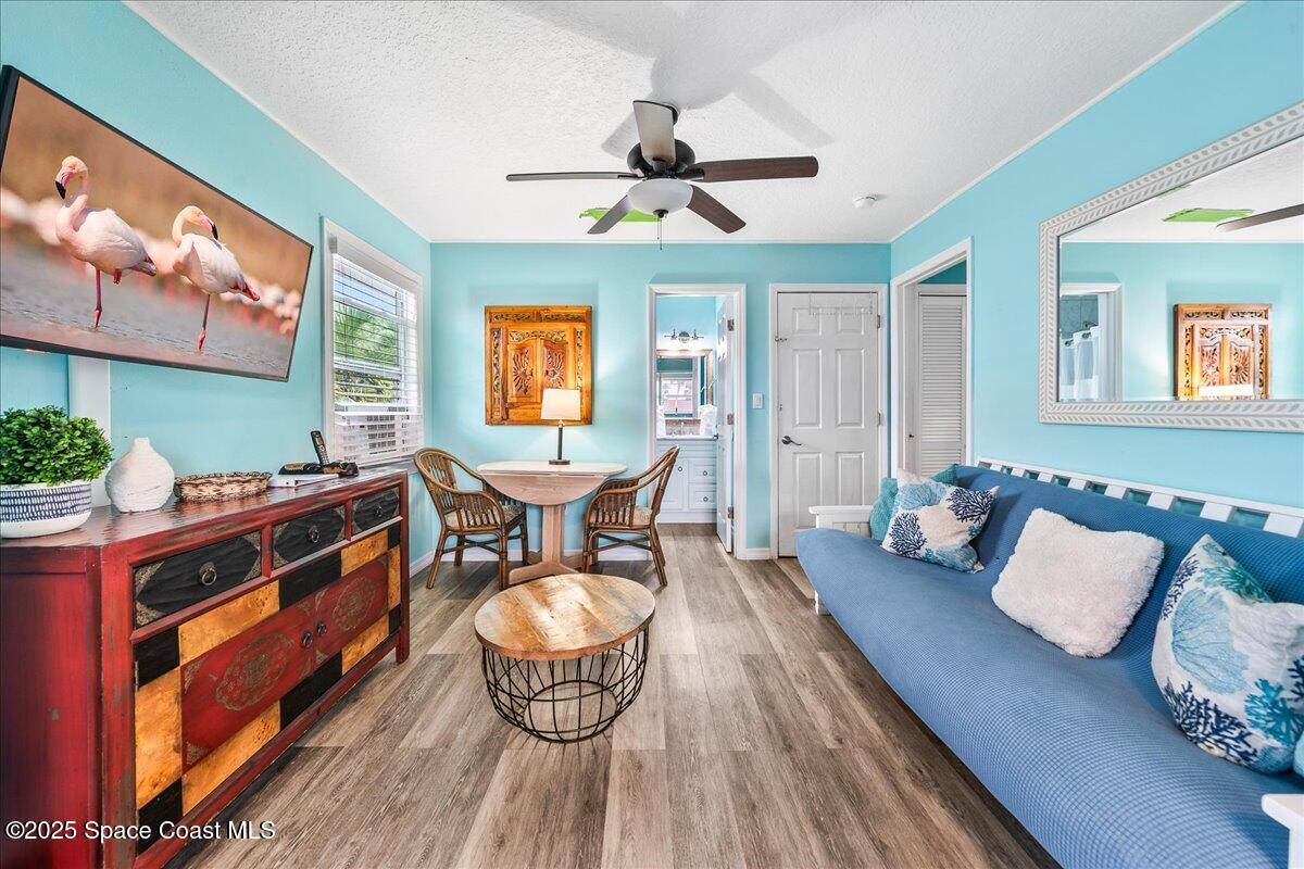 111 South Atlantic Avenue Cocoa Beach, FL 32931 - Photo 33 of 71 a living room with furniture and a wooden floor
