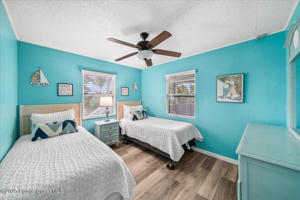 111 South Atlantic Avenue Cocoa Beach, FL 32931 - Photo 35 of 71 a bedroom with two beds and a table