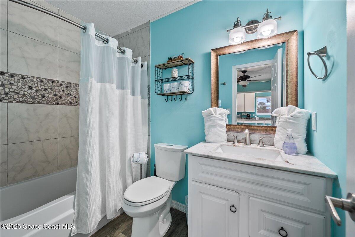 111 South Atlantic Avenue Cocoa Beach, FL 32931 - Photo 37 of 71 a bathroom with a sink toilet and shower