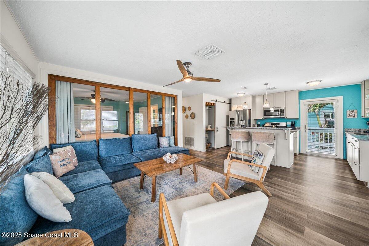 111 South Atlantic Avenue Cocoa Beach, FL 32931 - Photo 39 of 71 a living room with furniture and a large window