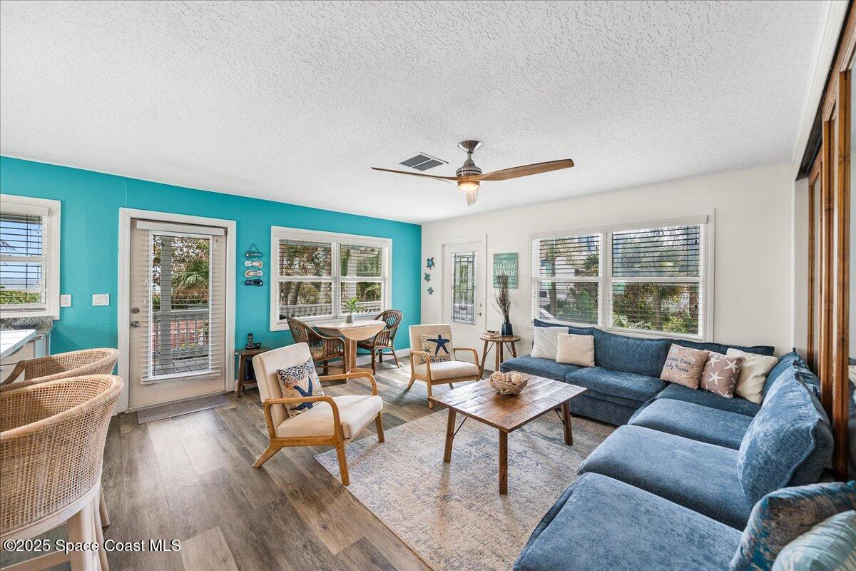 111 South Atlantic Avenue Cocoa Beach, FL 32931 - Photo 40 of 71 a living room with furniture and a large window