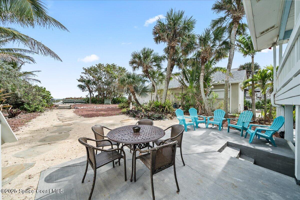 111 South Atlantic Avenue Cocoa Beach, FL 32931 - Photo 50 of 71 a view of a tables and chairs in a patio