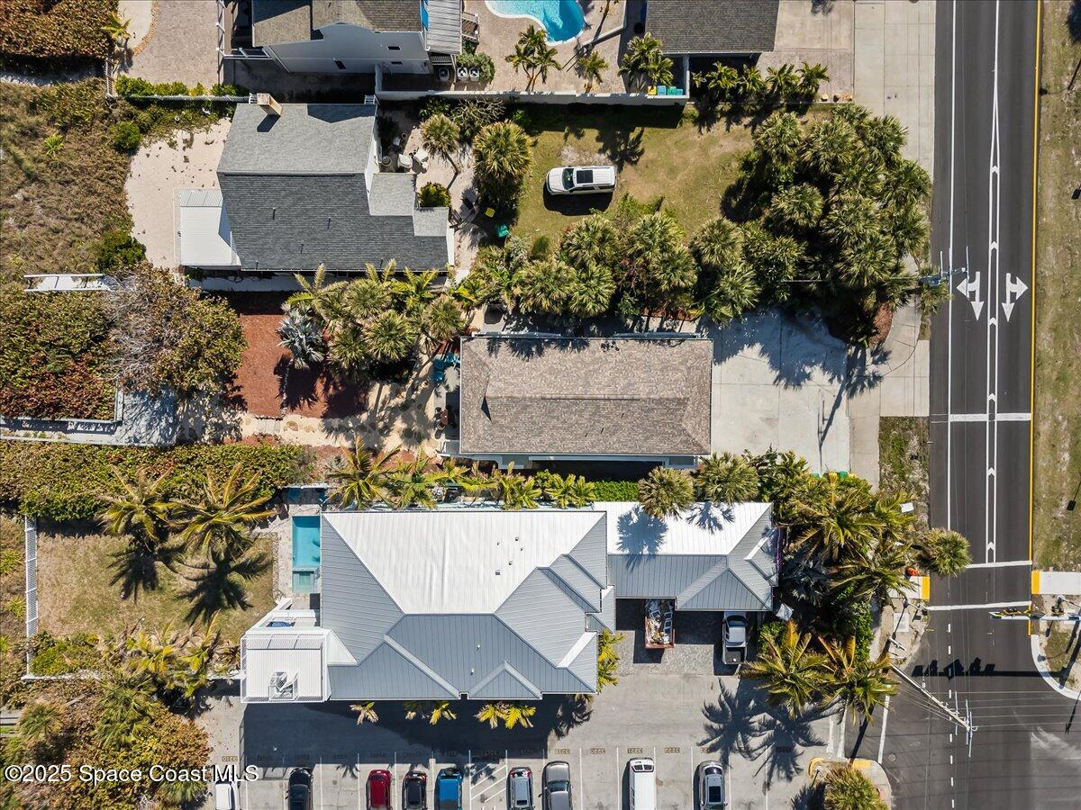 111 South Atlantic Avenue Cocoa Beach, FL 32931 - Photo 53 of 71 an aerial view of a house with a yard
