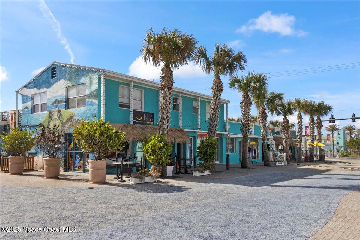 111 South Atlantic Avenue Cocoa Beach, FL 32931 - Photo 67 of 71 a view of a street with a building in the background