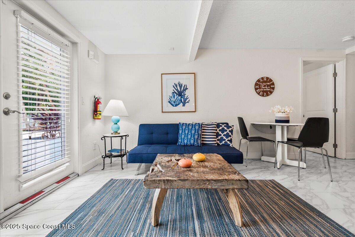 111 South Atlantic Avenue Cocoa Beach, FL 32931 - Photo 8 of 71 a view of a dining room with furniture and wooden floor