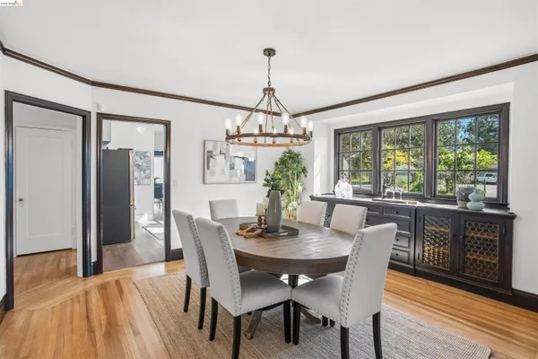 a dining room with furniture window wooden floor
