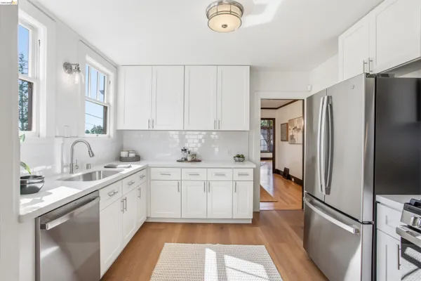 a kitchen with a sink stove and refrigerator