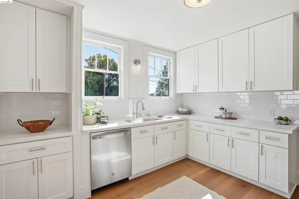 a kitchen with a sink and cabinets