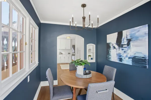 a dining room with furniture and window