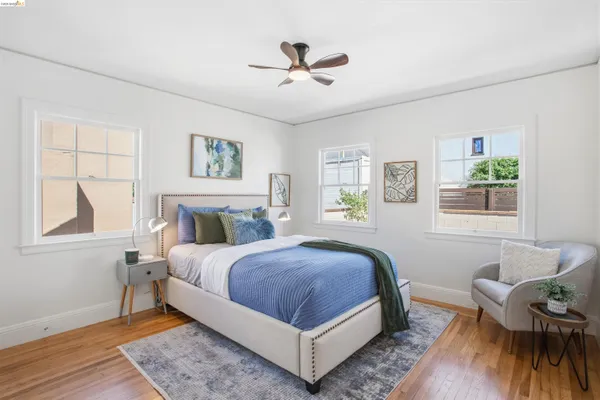 a spacious bedroom with a bed and window