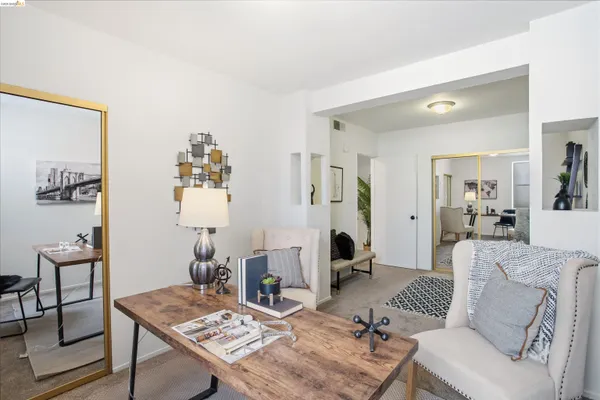 a living room with furniture and a table