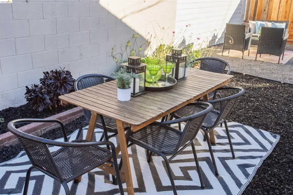 a view of a table and chairs on the roof deck