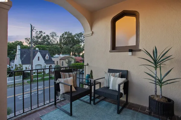 a view of a balcony with a potted plant