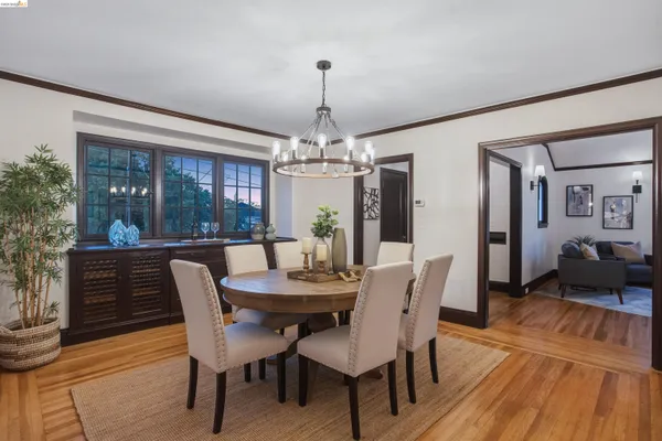 a spacious bathroom with double vanity a mirror and a bathtub