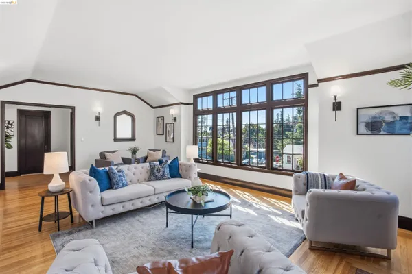 a living room with furniture and a large window