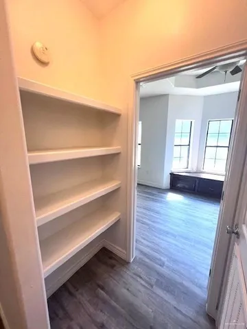 a view of room with wooden floor and window