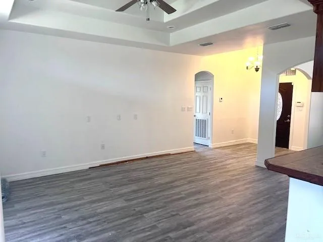 a view of a room with wooden floor and stairs