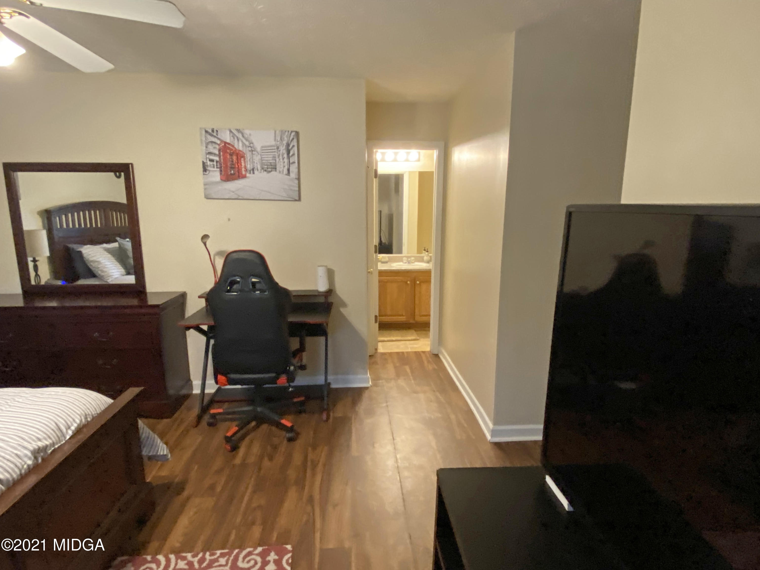 167 Apple Valley Road Macon, GA 31217 - Photo 13 of 25 a view of a workspace with furniture and wooden floor