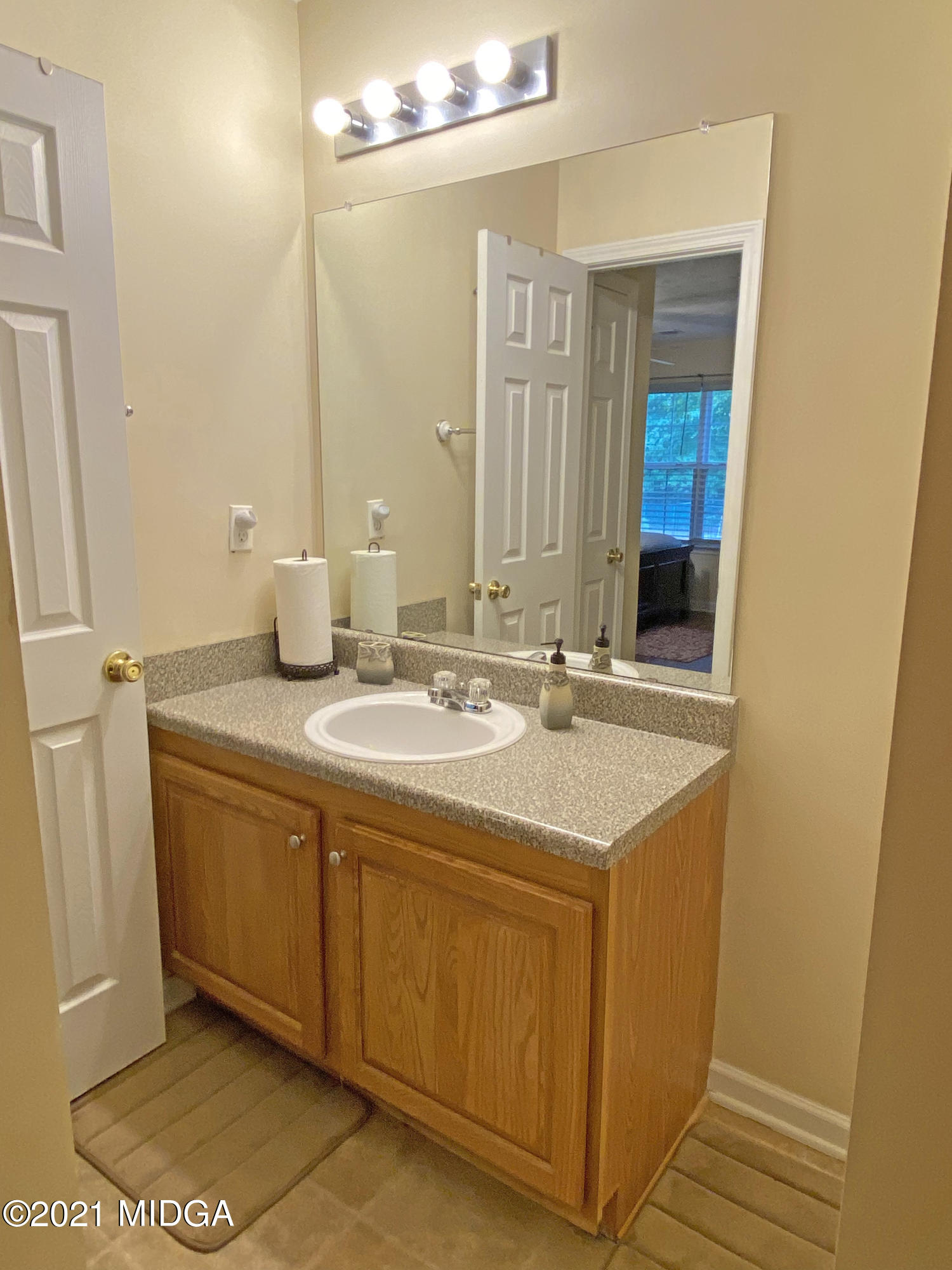 167 Apple Valley Road Macon, GA 31217 - Photo 14 of 25 a bathroom with a sink and a mirror