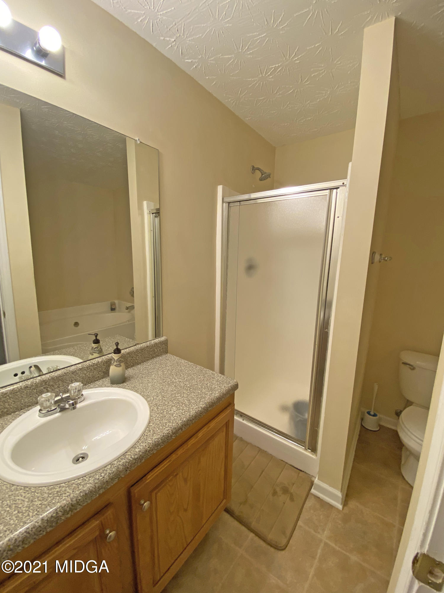 167 Apple Valley Road Macon, GA 31217 - Photo 15 of 25 a bathroom with a sink and a mirror