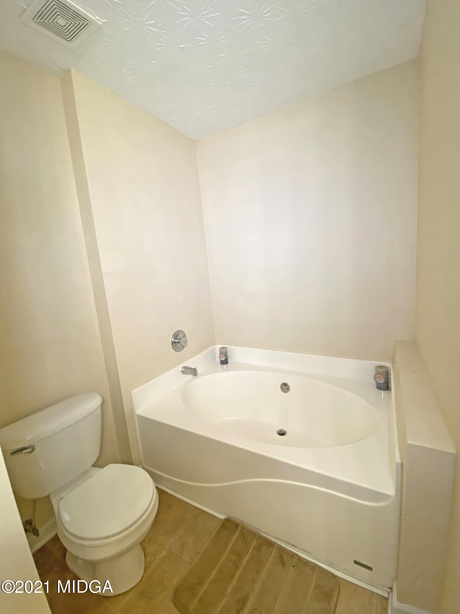 167 Apple Valley Road Macon, GA 31217 - Photo 16 of 25 a white bath tub sitting next to a white toilet