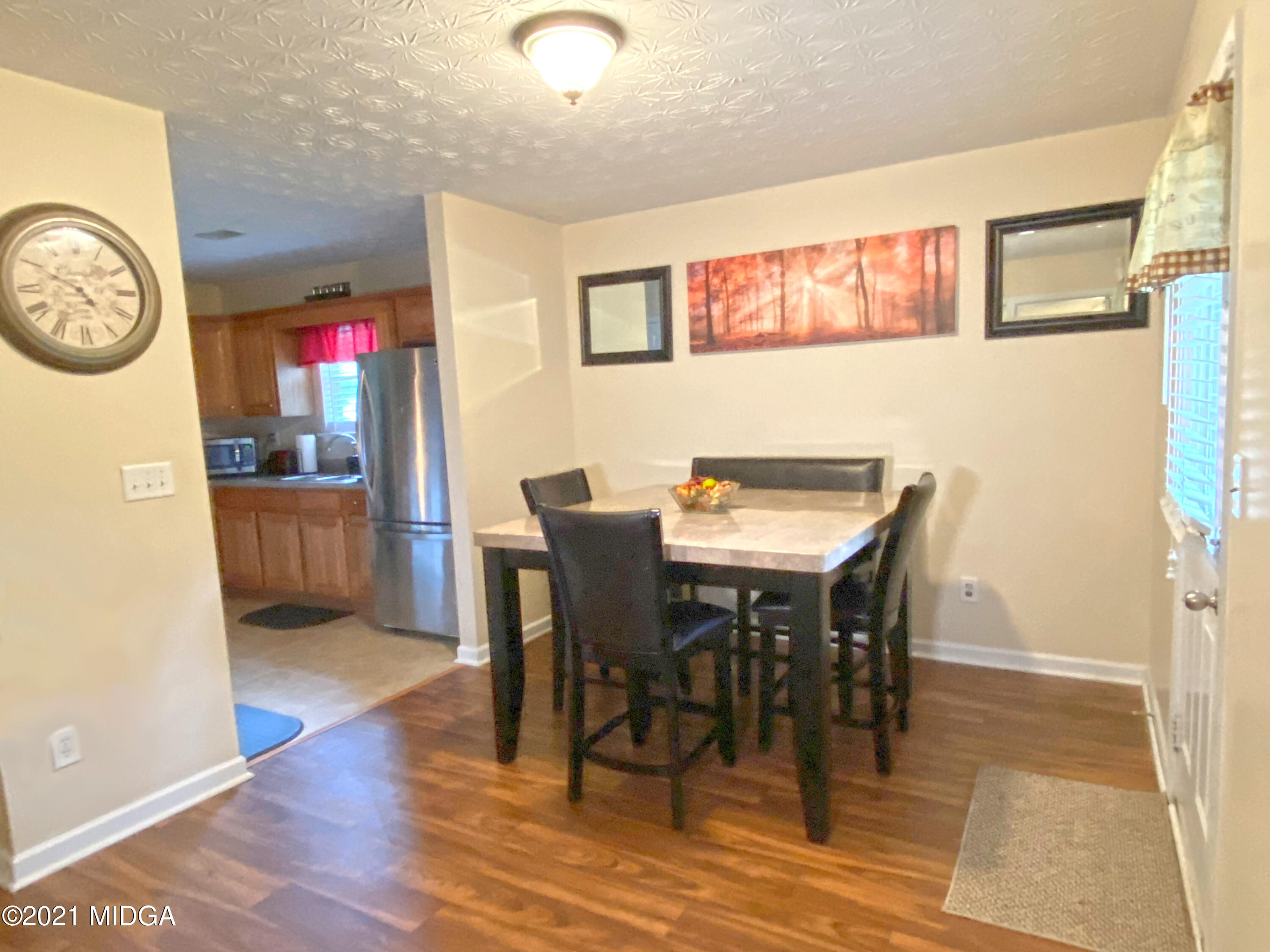 167 Apple Valley Road Macon, GA 31217 - Photo 20 of 25 a view of a dining room with furniture and a chandelier