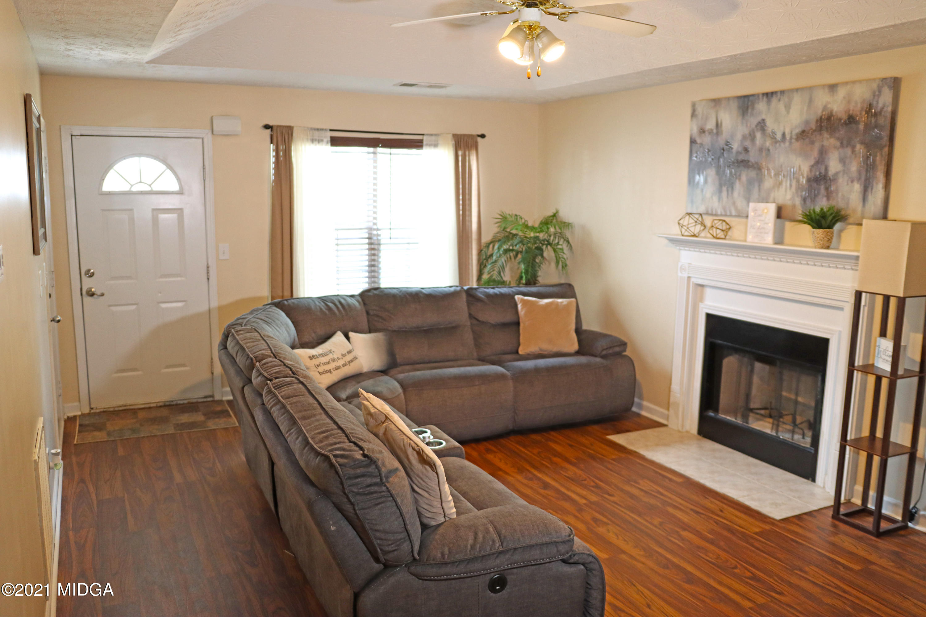 167 Apple Valley Road Macon, GA 31217 - Photo 3 of 25 a living room with furniture and a fireplace
