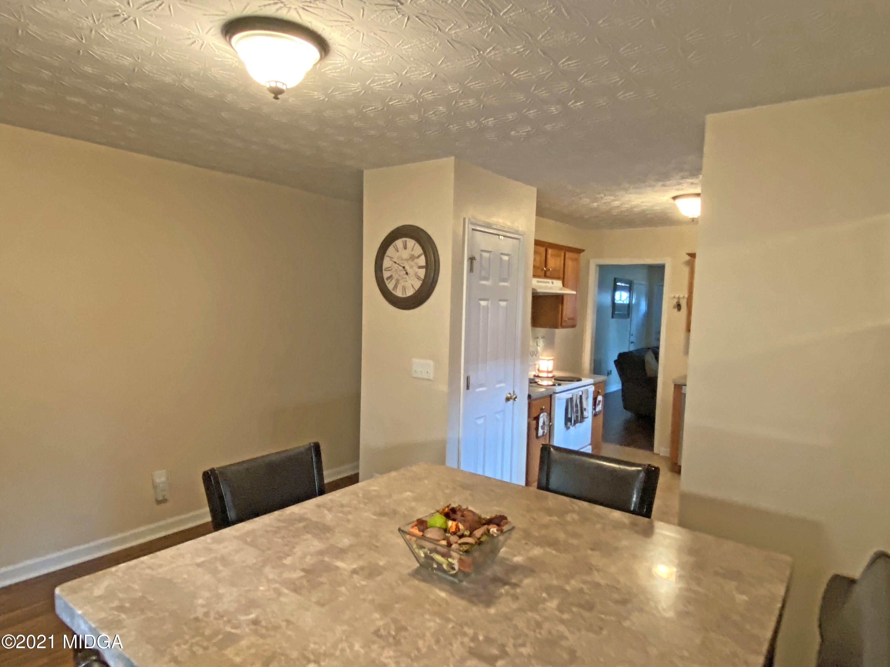 167 Apple Valley Road Macon, GA 31217 - Photo 21 of 25 a bedroom with a bed and a table in it