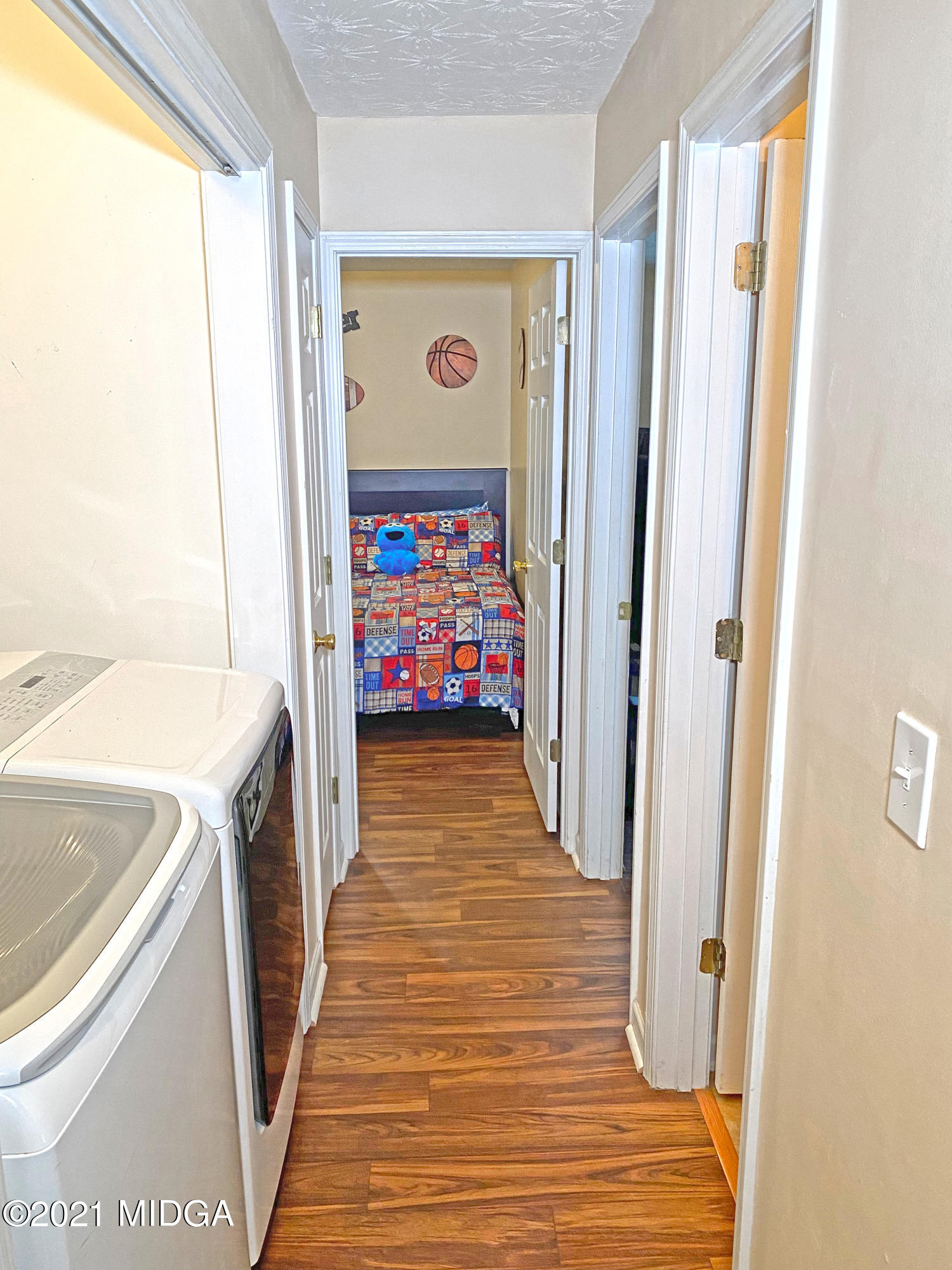 167 Apple Valley Road Macon, GA 31217 - Photo 23 of 25 a view of a hallway with wooden floor and furniture