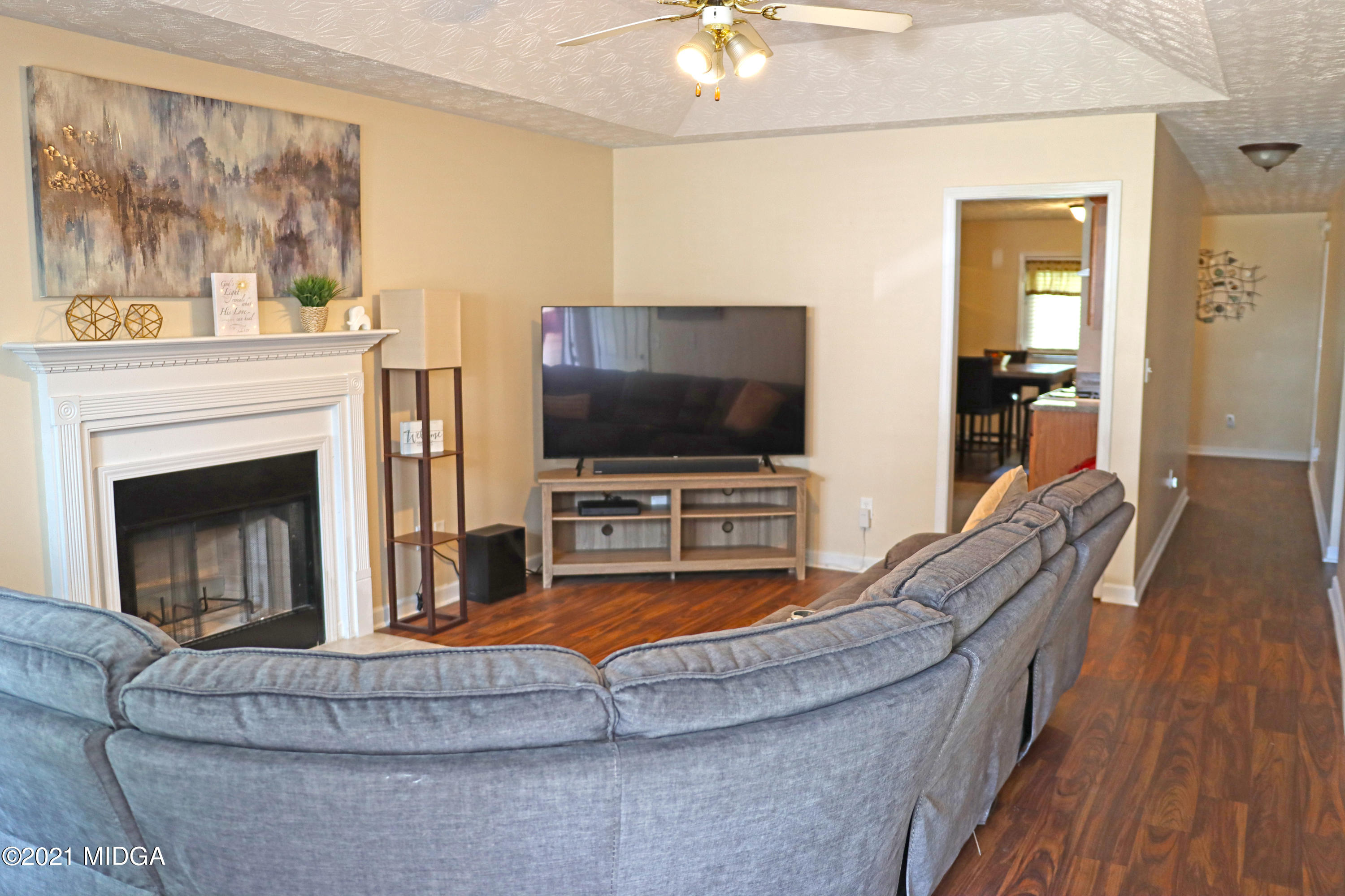 167 Apple Valley Road Macon, GA 31217 - Photo 5 of 25 a living room with furniture and a flat screen tv