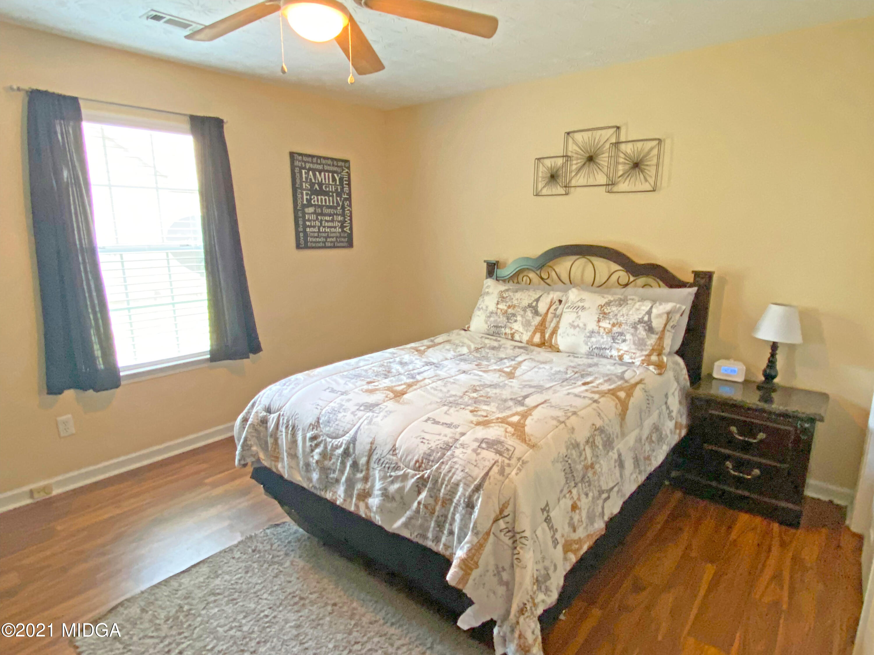 167 Apple Valley Road Macon, GA 31217 - Photo 6 of 25 a bed sitting in a bedroom next to a window