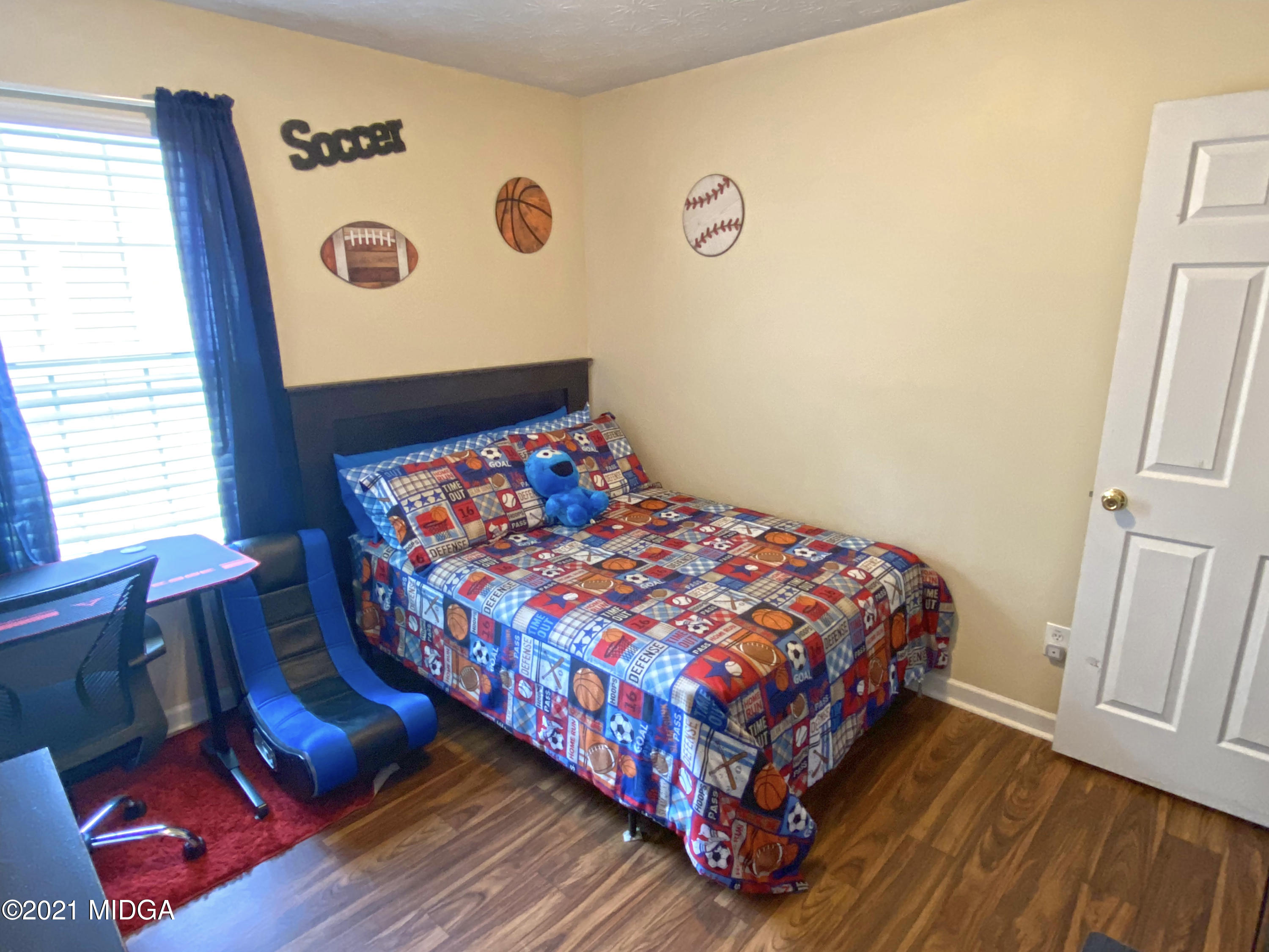 167 Apple Valley Road Macon, GA 31217 - Photo 7 of 25 a bedroom with a bed and a window