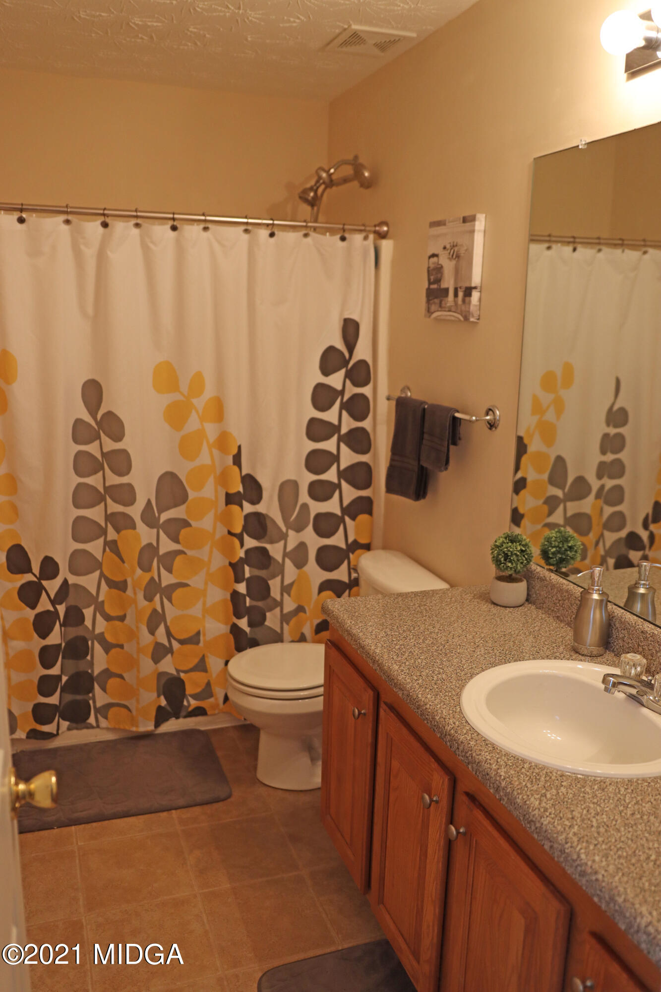 167 Apple Valley Road Macon, GA 31217 - Photo 9 of 25 a bathroom with a granite countertop sink toilet and shower