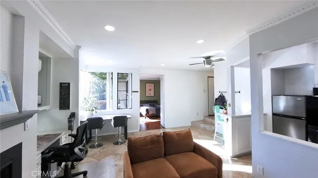 a view of a living room and a fireplace